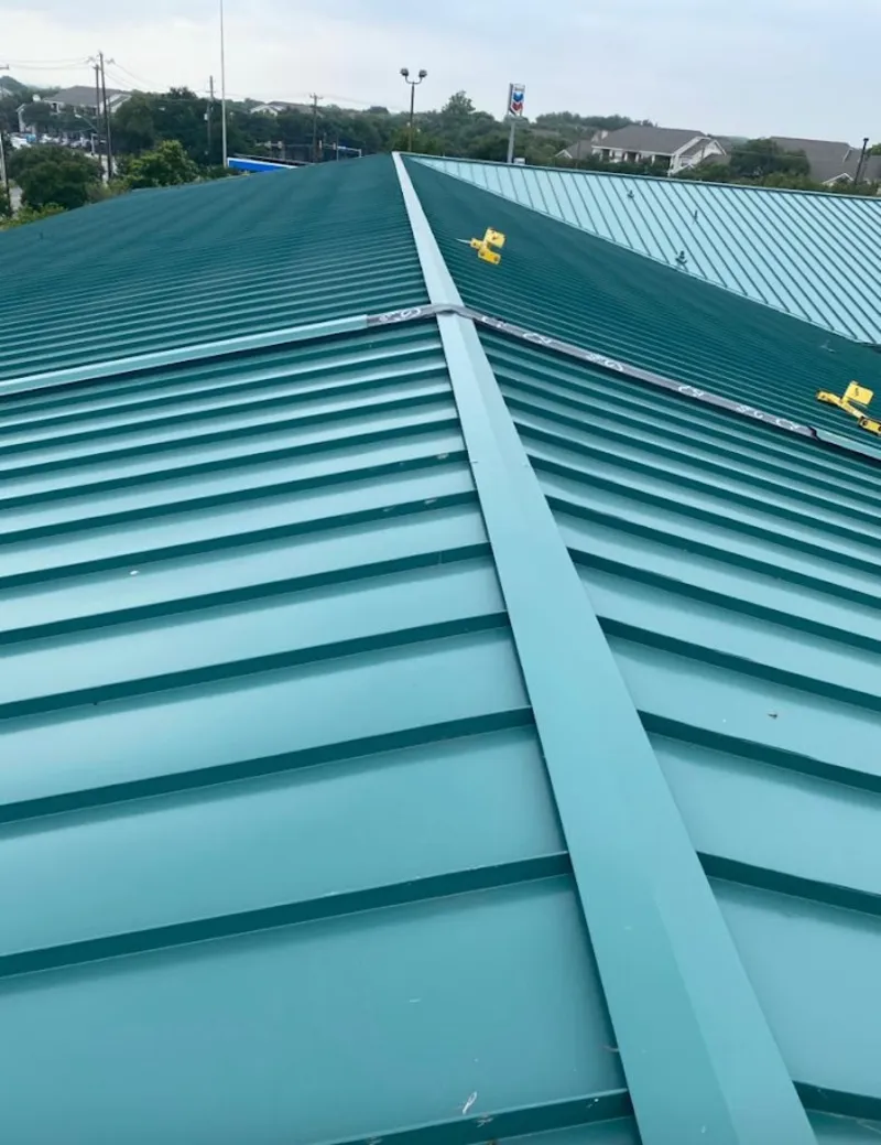 Green commercial metal roof ridge and valley for Metal Roof Repair in Marshalltown